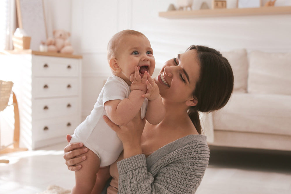 A mother holding her baby close